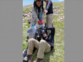 Students Max Plichta and Diamond Nwaeze measure the foot of a pika. Photo by Chris Ray, July 2014.