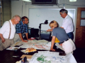 Mark Meier, Mark Dyurgerov, Vladimir Konovalov, and Karen Lewis pore over maps.  Photo by Vladimir Konovalov, June 1999.