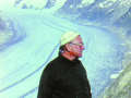 Above a tongue of Grossaletschgletscher in Switzerland, Mark Meier in a national Georgian cap he brought at a symposium that just finished in Tbilisi. Photo by Vladimir Kotlyakov, 1978.
