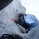 Leah M. wires ultrasonic snow depth sensors to a datalogger on Niwot Ridge (3528-m)...sadly after the logger box was buried by 1.5 m of snow. Photo by Leah Meromy, January 2011.