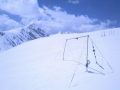 A view of the continental divide from near the Saddle on Niwot Ridge. Automated ultrasonic depth sensors are mounted to measure snow depth through the accumulation and ablation season. May 2013. Photo: Dominik Schneider.